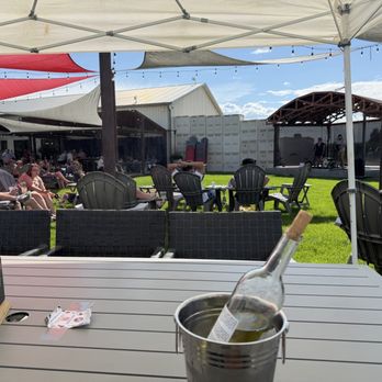 Restoration Vineyards - Outdoor covered seating area with stage - July 14, 2026 - Wine Tasting Room Near Me - Palisade, Colorado
