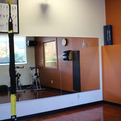 Anytime Fitness - Small fitness room with spin bikes, TRX, and Wellbeats classes (projection classes available 24/7).