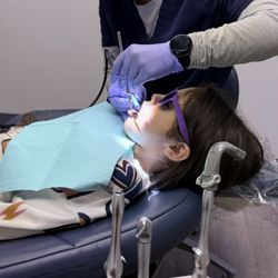 Sweet Tooth Pediatrics - Child getting a cleaning.