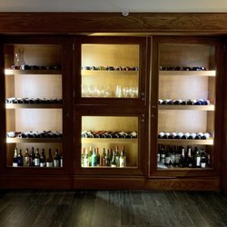 El Cortijo - Bottles of wine on display by the entrance