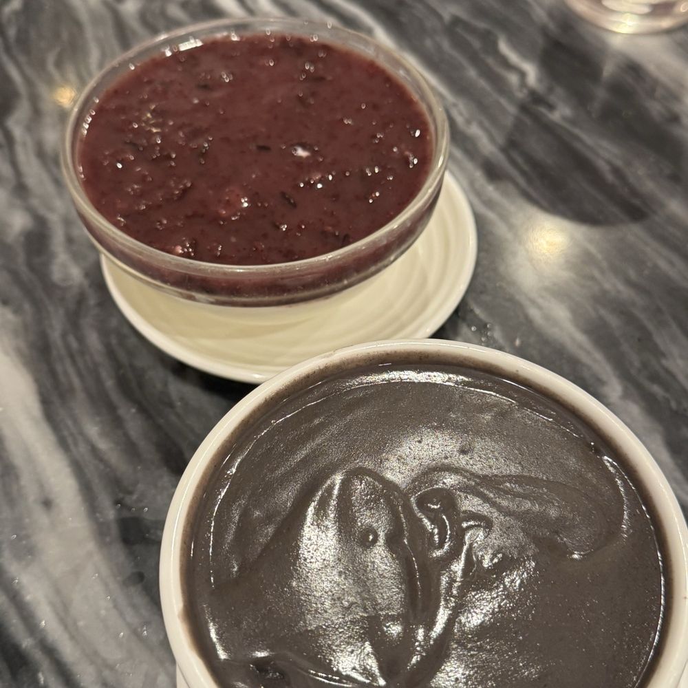 Black sticky rice with steamed milk and black sesame paste Black sticky rice with steamed milk and black sesame paste