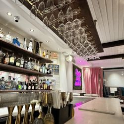 Empanada Loca - Bar and entrance hidden with pink curtain