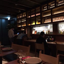Mak Mak - Shot of the kitchen area behind glass and the bar sitting area.