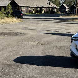 Lake Lodge Cabins - Giant potholes in parking lot
