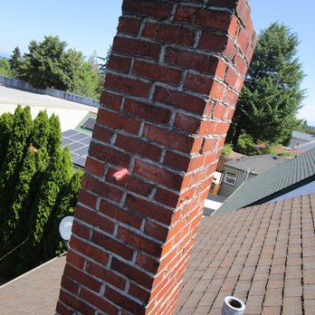 Oregon Chimney - Old chimney - slanted, loose bricks, mortar decay - Chimney Sweeps Near Me - Portland, Oregon