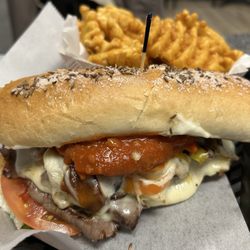 Jonny C's NY Deli - "The Ry Guy" - roast beef, hot chicken fingers, horseradish blue cheese dressing, on a kimmelweck sub roll.