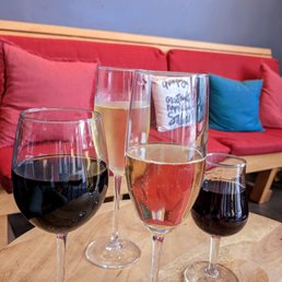 three glasses of wine on a table three glasses of wine on a table