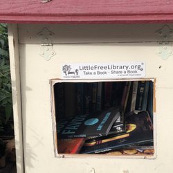 Little Free Library - An olde white library.
