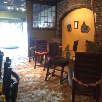 Cask & Vine - Several inches of sand on the floor and leis on the chairs during Beach Week - Beer Bar Near Me - Derry, New Hampshire