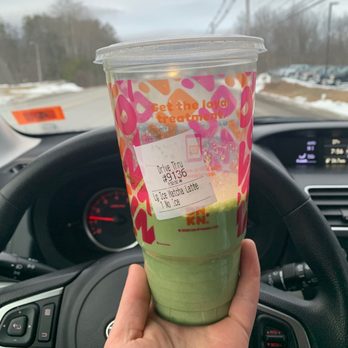 Dunkin' -  a hand holding a cup of green tea - Coffee & Tea Near Me - Plymouth, New Hampshire