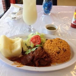 Beef plate with rice and beans, yucca and side salad