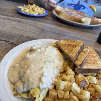 TJ's Homestyle Restaurant - Country Omelet (Eggs bacon, sausage, ham) side potatoes and toast - American Near Me - Avondale, Arizona TJ's Homestyle Restaurant - Country Omelet (Eggs bacon, sausage, ham) side potatoes and toast - American Near Me - Avondale, Arizona