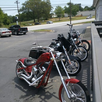 The Station - a row of motorcycles parked in a parking lot - Pubs Near Me - Simpsonville, South Carolina