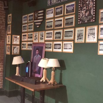 The Deep Inn - a table with two lamps on it - Bars Near Me - Newark, New Jersey