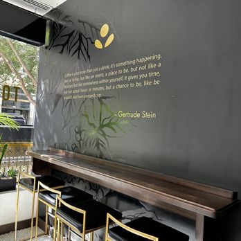 Topeca Coffee - a wall with a quote on it - Coffee & Tea Near Me - Tulsa, Oklahoma