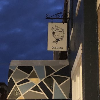 Old Hat Bar - a clock on the side of a building - Gastropubs Near Me - Alexandria, Virginia Old Hat Bar - a clock on the side of a building - Gastropubs Near Me - Alexandria, Virginia