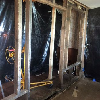 Craig Builders - Working on knocking out the wall and adding a LvL  to support the bearing wall - Roofing Near Me - Port Austin, Michigan