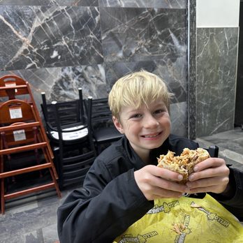Hello Shawarma - Happy kid eating a chicken shawarma. - Halal Near Me - Bridgeview, Illinois