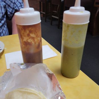 El Charro Oaxaca - The red bottle was a spicy salsa, good flavor. The green bottle was a mild salsa, not hot at all, but full of flavor. - Mexican Near Me - Victorville, California