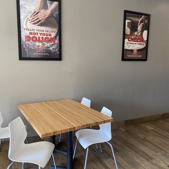 Marco's Pizza - a table and chairs in a restaurant - Pizza Near Me - Memphis, Tennessee Marco's Pizza - a table and chairs in a restaurant - Pizza Near Me - Memphis, Tennessee