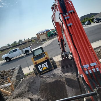 Kamaaina Landscaping - a cat excavator working on a construction site - Tree Services Near Me Kamaaina Landscaping - a cat excavator working on a construction site - Tree Services Near Me