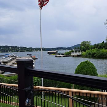 Down The Hatch - an american flag flying over a lake - American Near Me - Brookfield, Connecticut Down The Hatch - an american flag flying over a lake - American Near Me - Brookfield, Connecticut