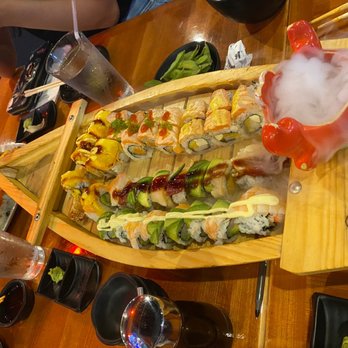 Koi Sushi - Sushi boat with 4 signature rolls - Japanese Near Me - Chicago, Illinois Koi Sushi - Sushi boat with 4 signature rolls - Japanese Near Me - Chicago, Illinois