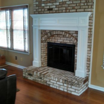 X-Act Builders - a brick fireplace in a living room - General Contractors Near Me - Frederick, Maryland X-Act Builders - a brick fireplace in a living room - General Contractors Near Me - Frederick, Maryland