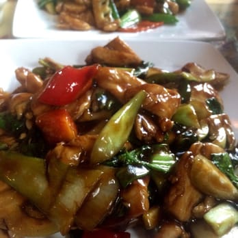 Little Dragon Cafe - Spicy thai basil chicken in front and chicken w mix veg in back; both delicious! - Chinese Near Me - Edwards, Colorado Little Dragon Cafe - Spicy thai basil chicken in front and chicken w mix veg in back; both delicious! - Chinese Near Me - Edwards, Colorado
