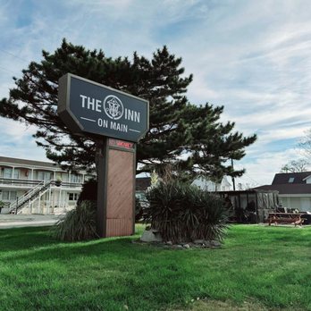 The Inn On Main - Main building and sign - Hotels Near Me - Chincoteague, Virginia The Inn On Main - Main building and sign - Hotels Near Me - Chincoteague, Virginia