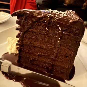 Metropolitan Grill - Nine Layer Chocolate Cake, would skip the sauce, ice cream is perfect compliment - American Near Me - Seattle, Washington