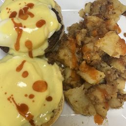 Eggs Benedict with sausage and house potatoes Eggs Benedict with sausage and house potatoes
