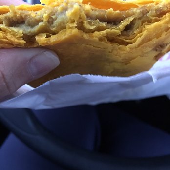 Golden Krust Caribbean Restaurant - Bitten close up inside chicken patty - Caribbean Near Me - Union, New Jersey