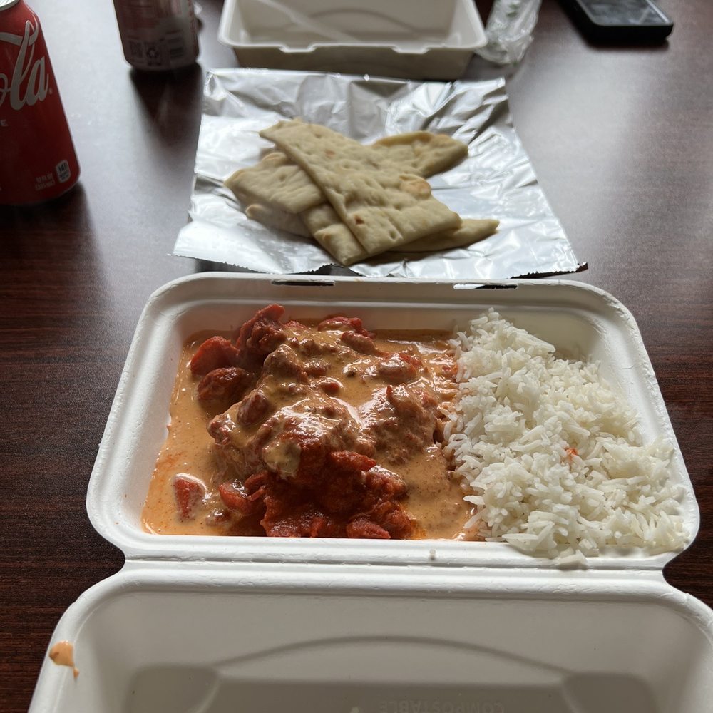 Bombay Curry - From top to bottom: butter chicken with rice, plain naan, tikka masala with rice. - Indian Near Me - Skagway, Alaska Bombay Curry - From top to bottom: butter chicken with rice, plain naan, tikka masala with rice. - Indian Near Me - Skagway, Alaska