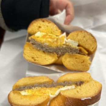 Gotham Bagels - a person holding a sandwich - Bagels Near Me - Madison, Wisconsin