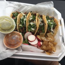 Taqueria Garcia - Pastor tacos on house made tortillas served with grilled onions & radish