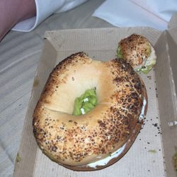 Dunkin Donuts - Port Richey - Small roach can be see next to a seed below to hole of the bagel. Hair is also present at the top.