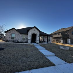 Abraham & Sons Masonry - Two beautiful stone flower beds and one tree ring completed out in Mansfield, Tx.