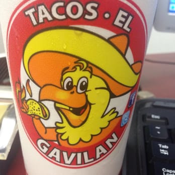 Tacos Gavilan - Look for the yellow chicken holding a taco with human hands and arms that are on fire and trying to smile while feeling the burn - Mexican Near Me - Huntington Park, California Tacos Gavilan - Look for the yellow chicken holding a taco with human hands and arms that are on fire and trying to smile while feeling the burn - Mexican Near Me - Huntington Park, California