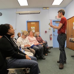 Rochester Public Library - Winton Branch - Answering questions on growing plants from seed.