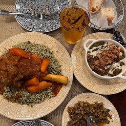 Lamb entree, kashkebademjan (eggplant), zeitoon parvarde (olive, walnut, herb & pomegranate appetizer), azizam cocktail. Lamb entree, kashkebademjan (eggplant), zeitoon parvarde (olive, walnut, herb & pomegranate appetizer), azizam cocktail.