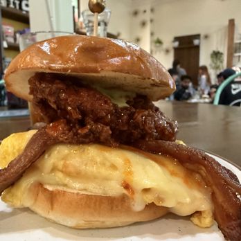 Millers All Day - HOT HONEY CHICKEN B.E.C. - hot honey chicken, bacon, scrambled egg, cheddar cheese, herb mayo, brioche bun - Breakfast & Brunch Near Me - Charleston, South Carolina Millers All Day - HOT HONEY CHICKEN B.E.C. - hot honey chicken, bacon, scrambled egg, cheddar cheese, herb mayo, brioche bun - Breakfast & Brunch Near Me - Charleston, South Carolina