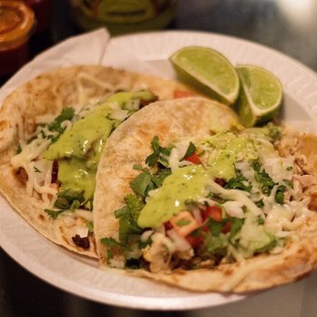 TRI Antojitos Mexicanos - two tacos on a paper plate - Food Trucks Near Me - Houston, Texas TRI Antojitos Mexicanos - two tacos on a paper plate - Food Trucks Near Me - Houston, Texas