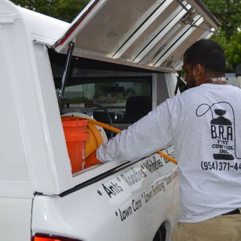 B.R.A Pest Control - About to spray a lawn for Ants - Pest Control Near Me