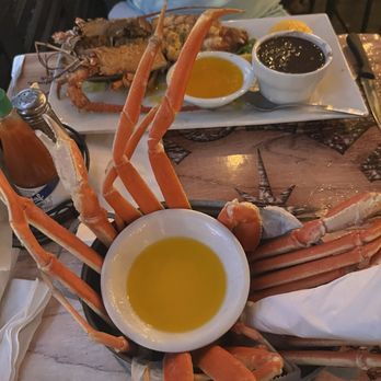 Catch Of The Day - Crab legs and grilled lobster with rice and black beans - Seafood Near Me - Miami, Florida Catch Of The Day - Crab legs and grilled lobster with rice and black beans - Seafood Near Me - Miami, Florida