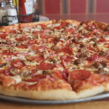 Bruno's  Bar -  pizza with pepperoni and sausage - Bars Near Me - St Johns, Michigan