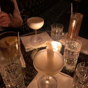 Noble Experiment - Chocolate flip (round glass at the back), sunflower (front) - Cocktail Bars Near Me - San Diego, California