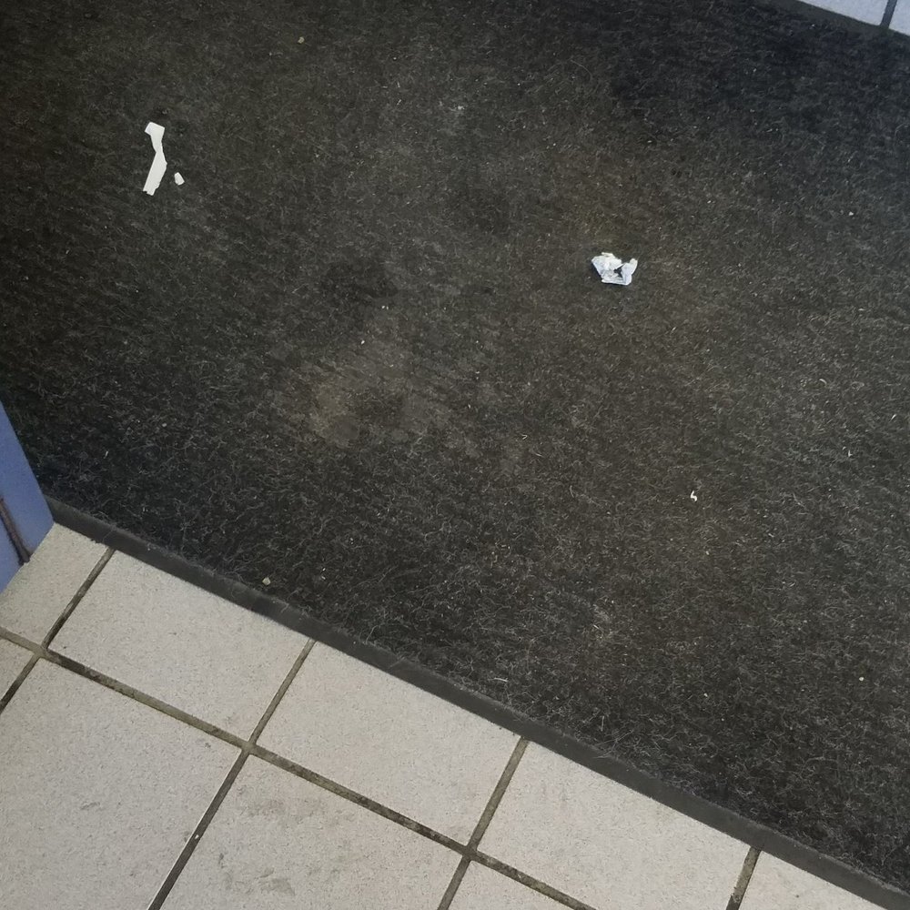 Trash on the floor. Trash on the floor.