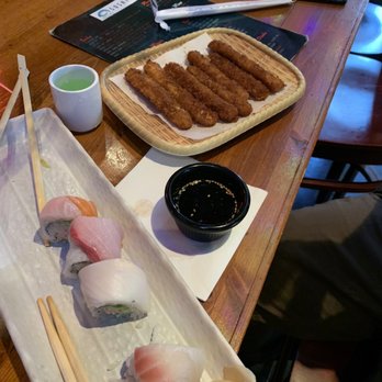 Sushiko - What is left of the rainbow roll, tempura calamari, and saki. Miso soup was gone before I could take a picture. Delicious!! - Sushi Bars Near Me - Bossier City, Louisiana