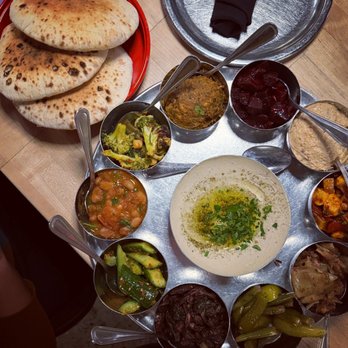 Laser Wolf - salads and hummus and pita - Middle Eastern Near Me - Philadelphia, Pennsylvania